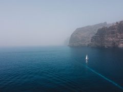 Sailing,Ship,Near,Los,Gigantes,Cliffs,In,Tenerife,,Canary,Islands